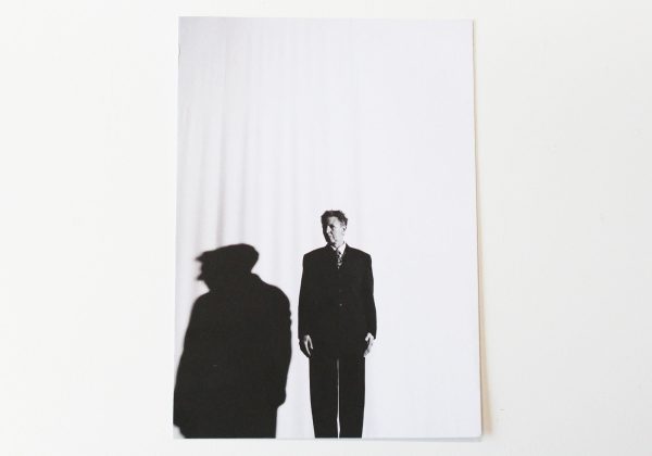 The front of the 'Must' postcard